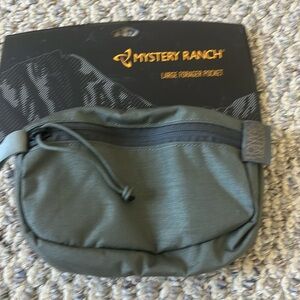 New in bag Mystery Ranch large forager pocket.
